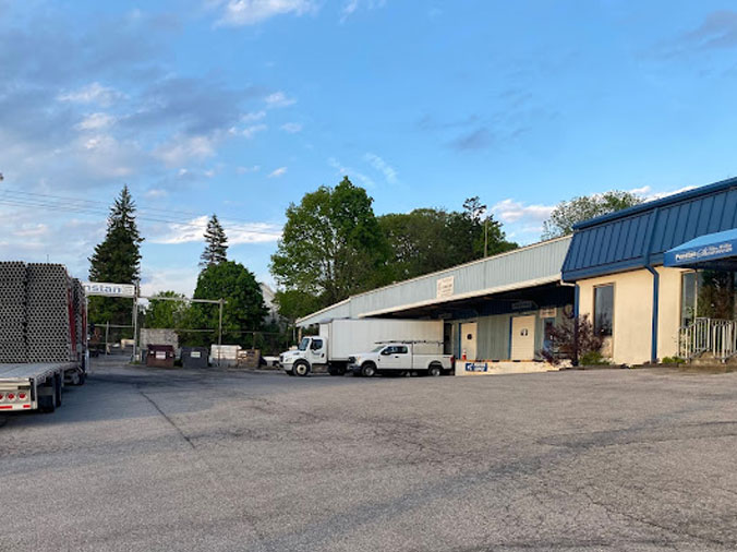 Penstan plumbing & Heating Supply Alottona PA - Exteriot front of building and stock yard beside it
